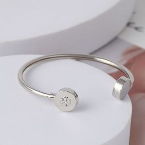 NWOT Tory Burch Silver Round Logo Cuff Bracelet